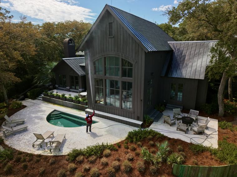 Aerial view of a Kiawah River home after soft washing