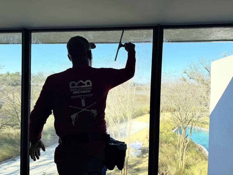 Squeegee window cleaning overlooking the Lowcountry marsh